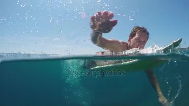 depositphotos 130785354 stock video slow motion underwater smiling surfer